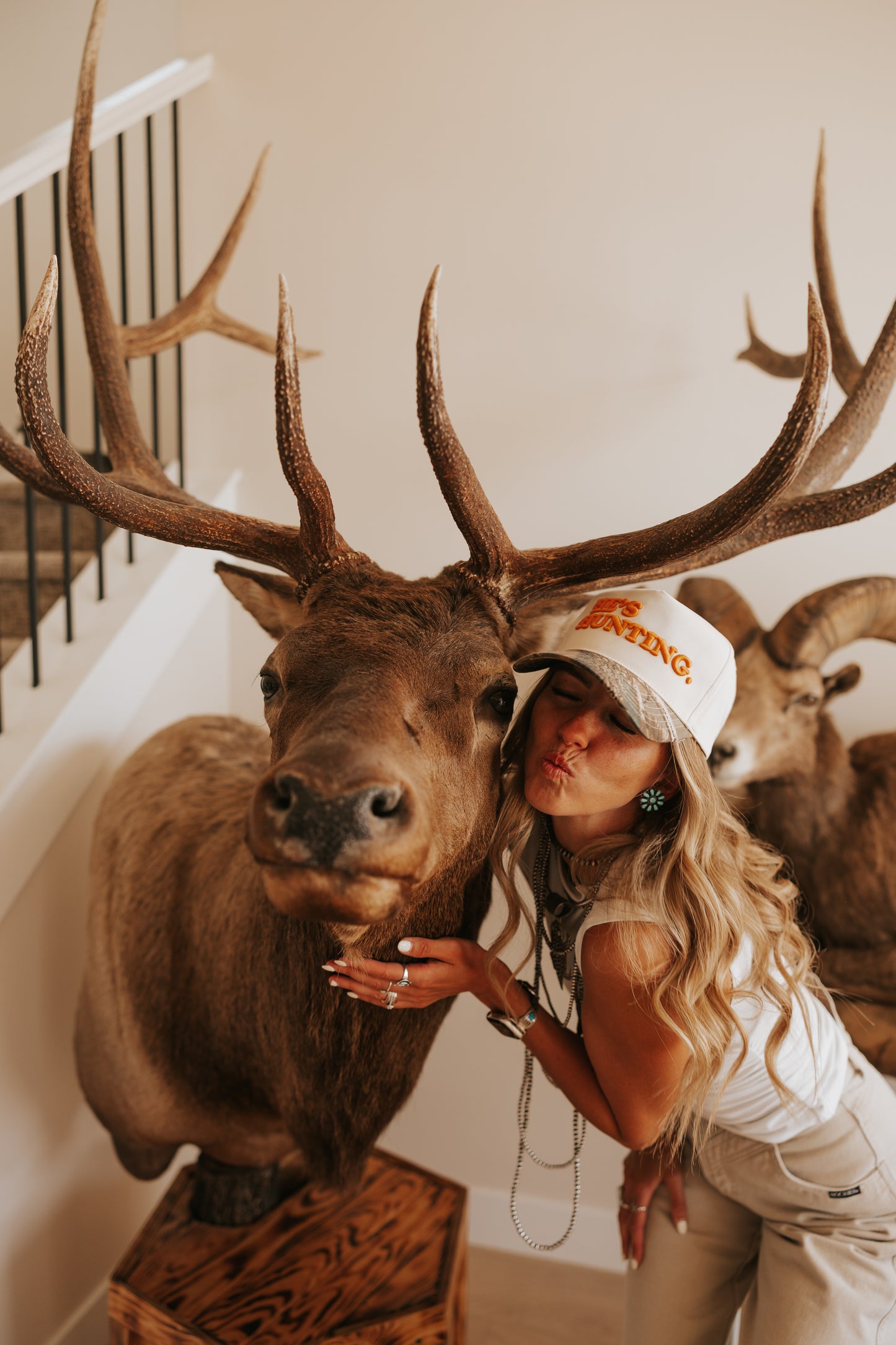 HE’S HUNTING TRUCKER HAT